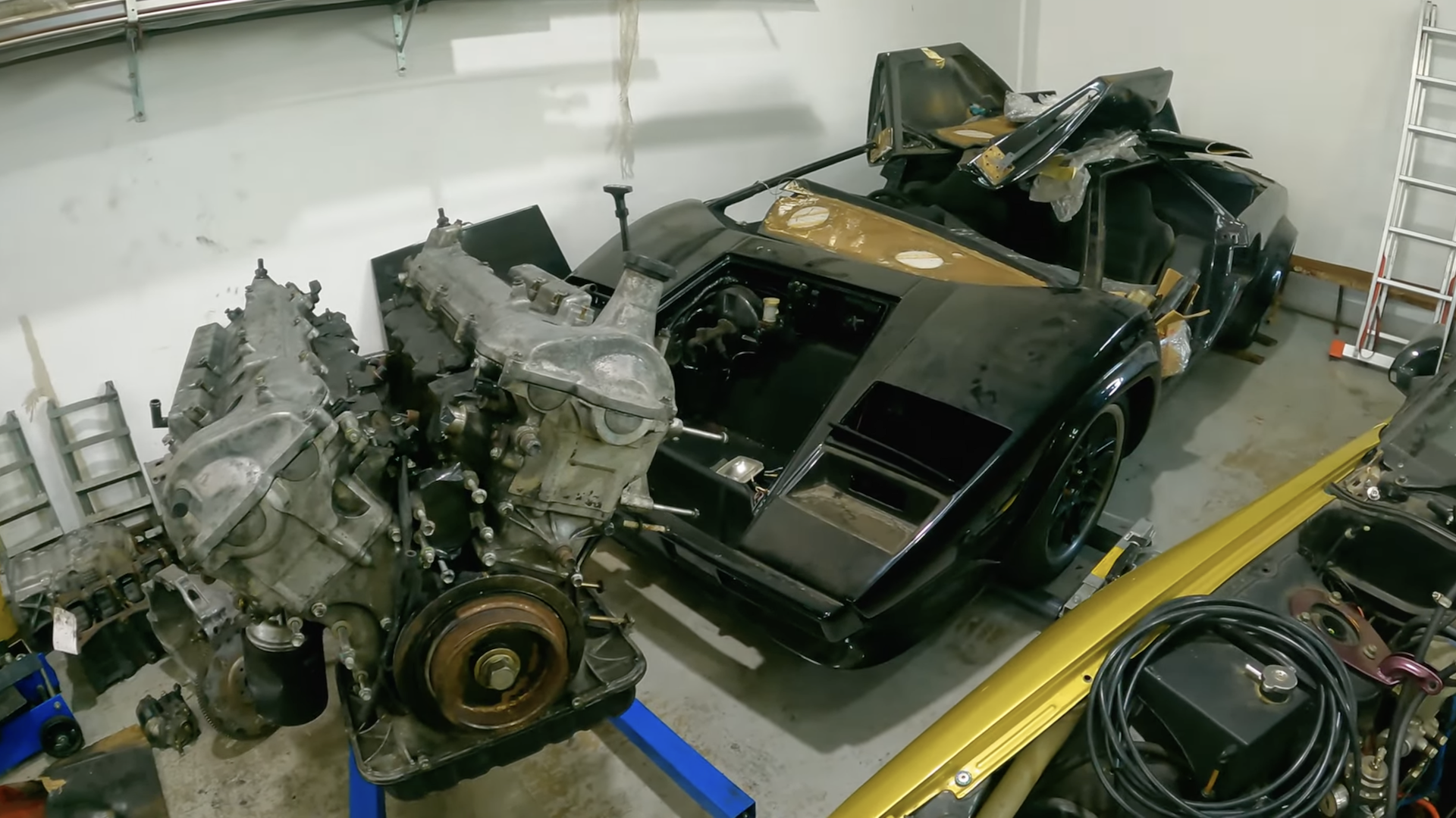 A Toyota V12 sits next to a Lamborghini Countach replica